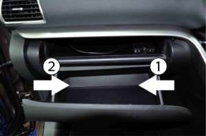 Push the right side of the glove box and remove the stopper on the right side